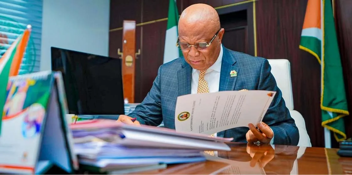 Governor Umo Eno reading at his desk