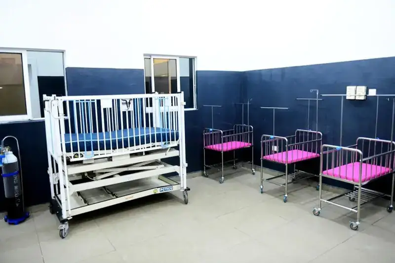 Renovated children's ward with cots and baby beds
