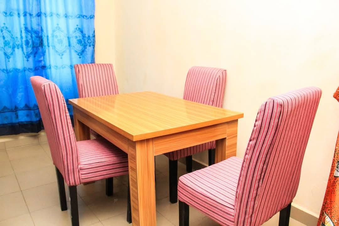 Dining table and four chairs in the furnished home