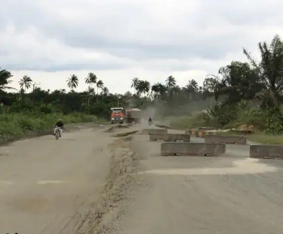 Lorry and barriers on the unfinished road section