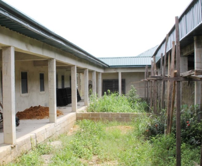 Covered walkway along the new school block under construction