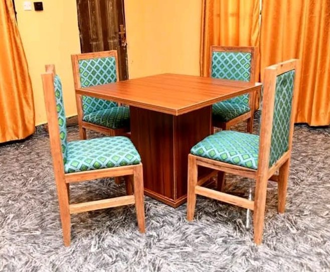 Furnished dining table and chairs inside a compassionate home