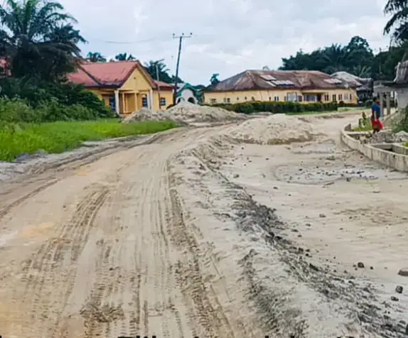 Earthworks on the Okoroete-Elile-Amadaka-Kampa Road near houses.