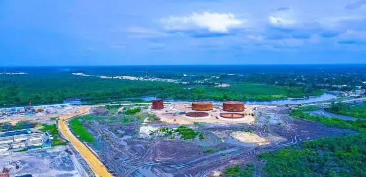 Aerial view of oil storage tanks beside creeks and mangrove forest