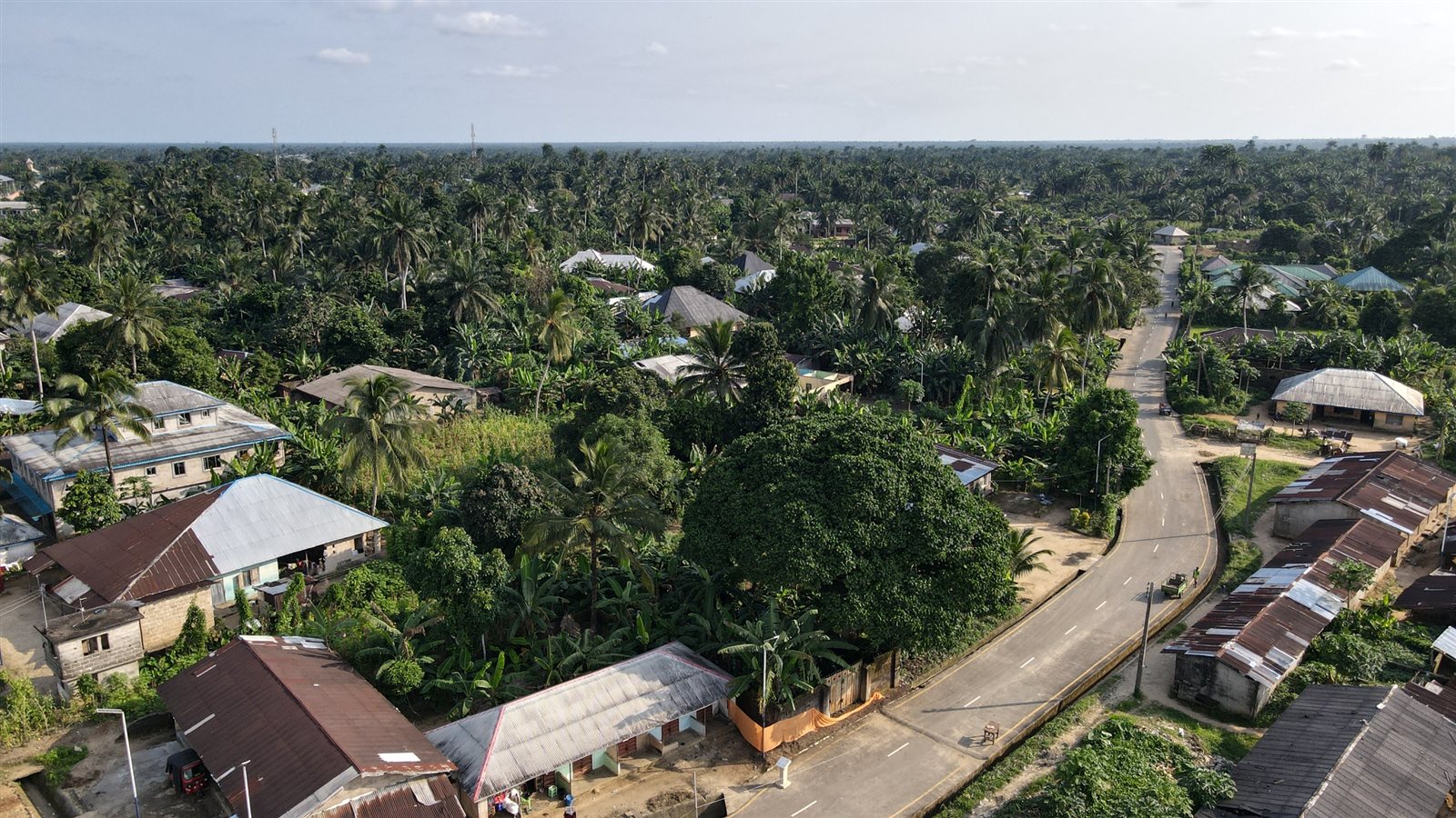 Aerial view of the completed road curving through the community