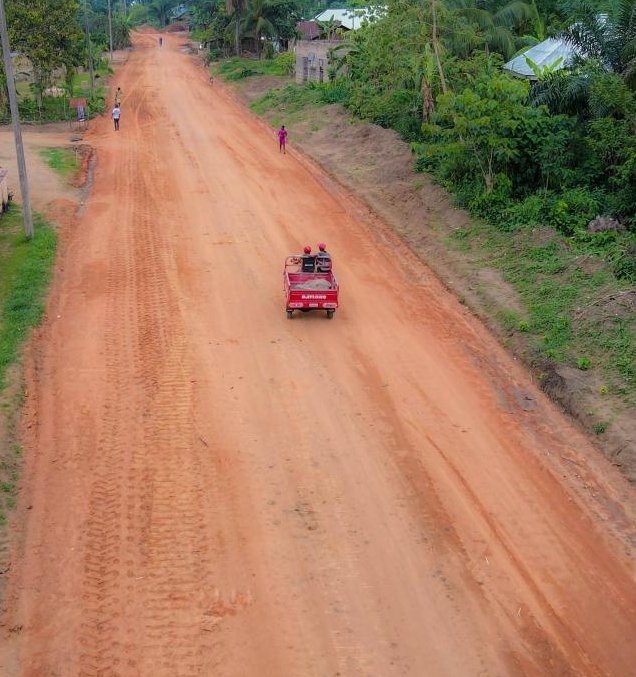 Graded red-laterite section of the Midim Atan road