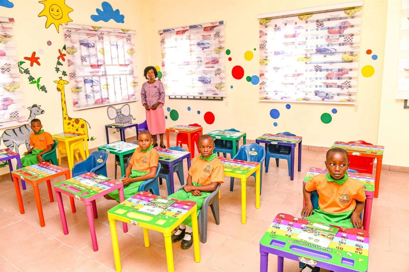 Nursery classroom with painted walls and small desks