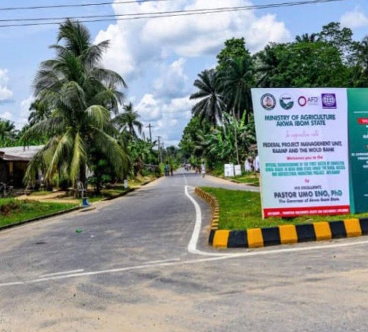 Road junction at the start of the road with project signboard