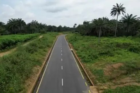 The paved road with its marked lanes