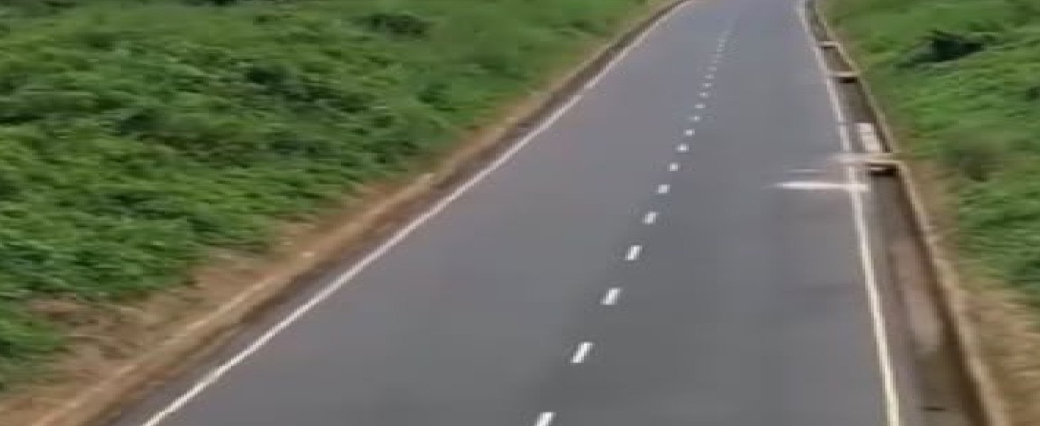 Another stretch of the road with its side drain