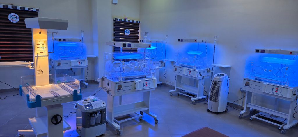 Newborn care unit with a row of incubators