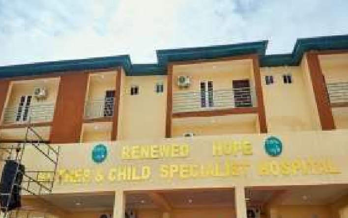 Front of the mother and child hospital with its name signage