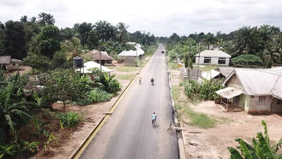 The asphalt road through a village during construction