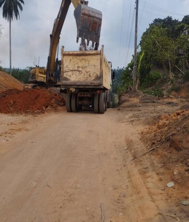 Excavator loading a truck during earthworks