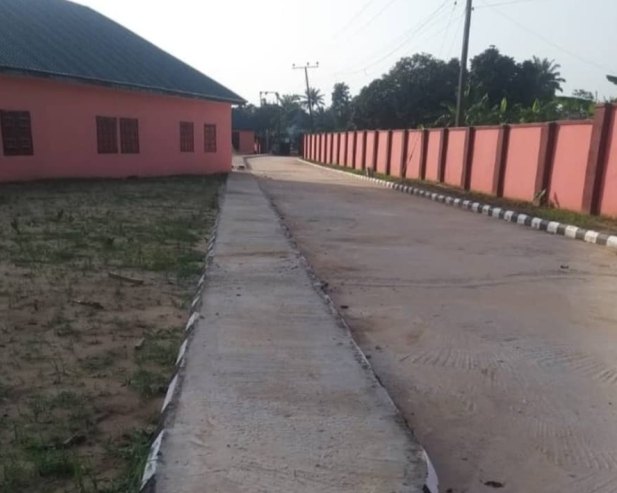 Walkway and compound wall beside the remodelled school blocks