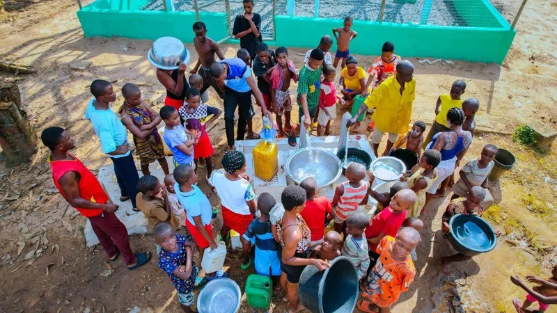 Residents collecting water from the Ini water scheme