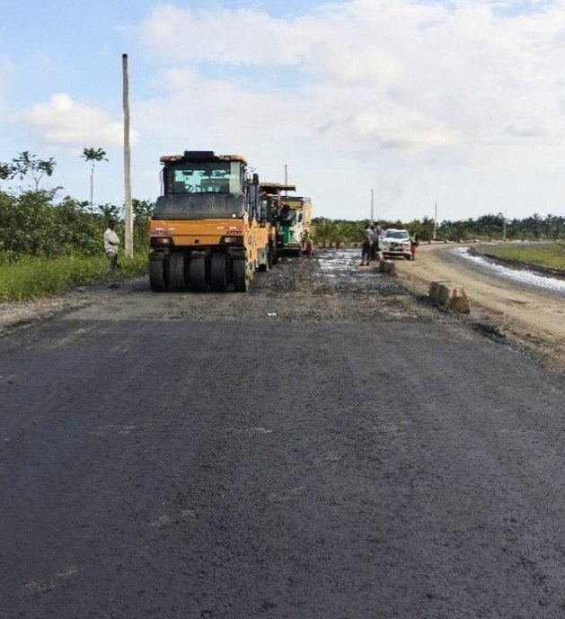 Roller and paver laying asphalt