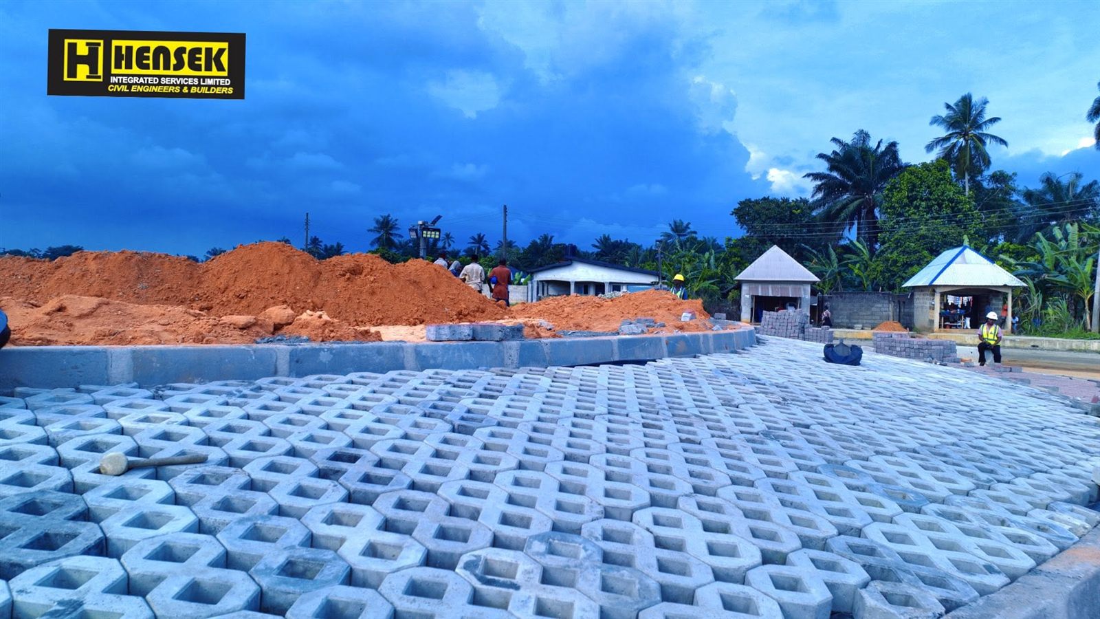 Grass-paver surface and roadside works near a junction