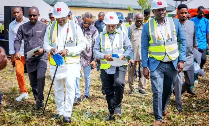 Officials walking the Chairman's Official Residence site