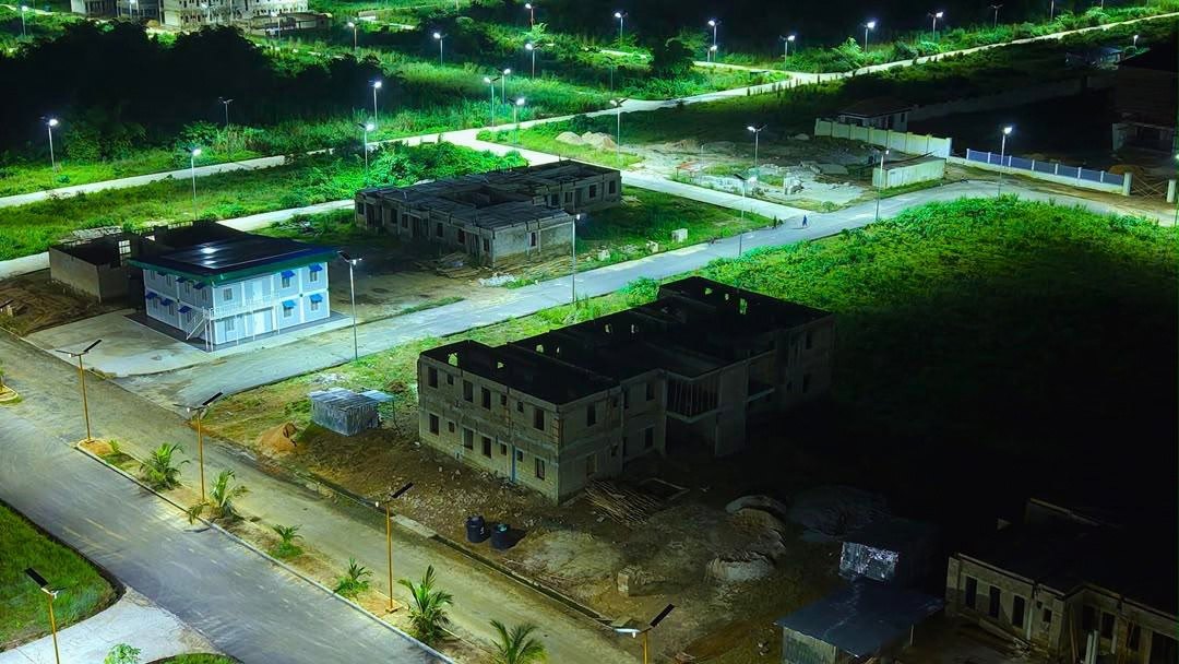 Buildings and roads on the farm lit at night