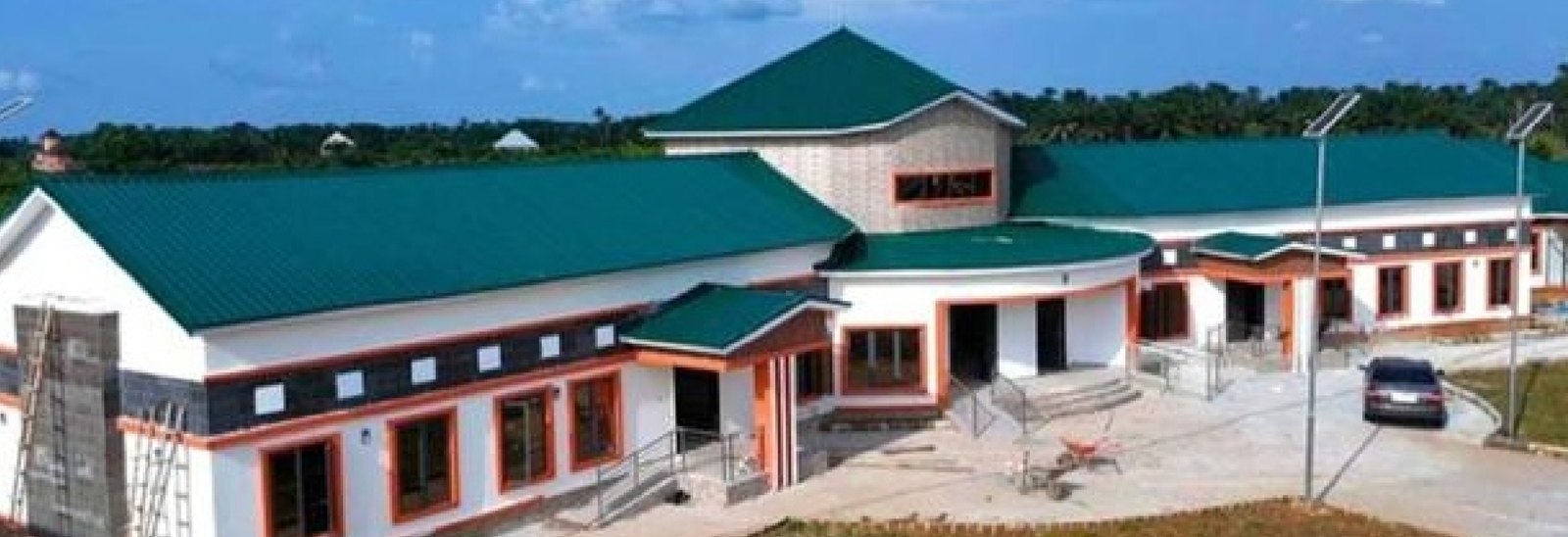 Front of the youth centre with green roofs and solar street lights
