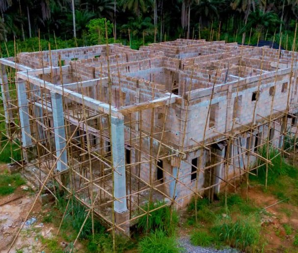Chairman's lodge building shell with scaffolding around the walls