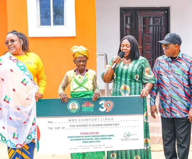 ARISE Compassionate Home handover with beneficiary board