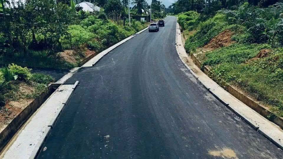 Finished road with concrete drains on both sides