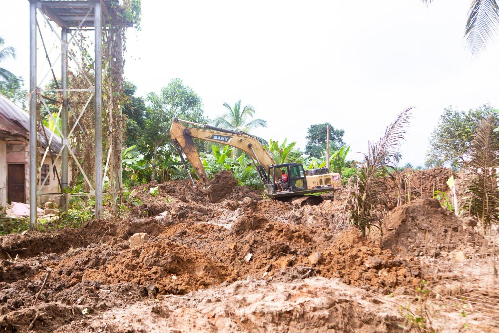 Excavator clearing the road line