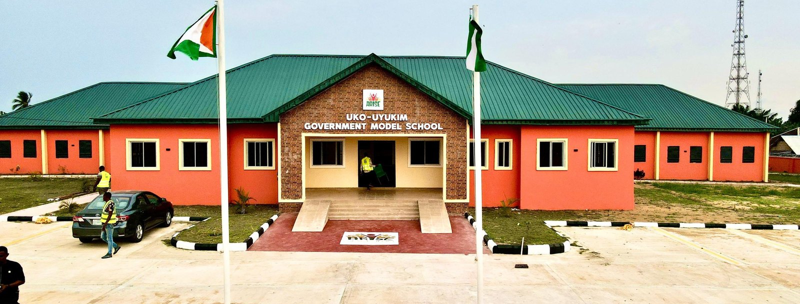 The school building with flags at the entrance