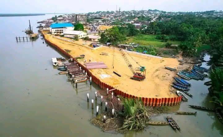 Aerial view of the Oron Beach waterfront with new steel shore protection and reclaimed land