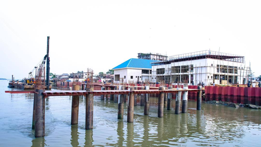 Jetty piles driven into the river beside the terminal building
