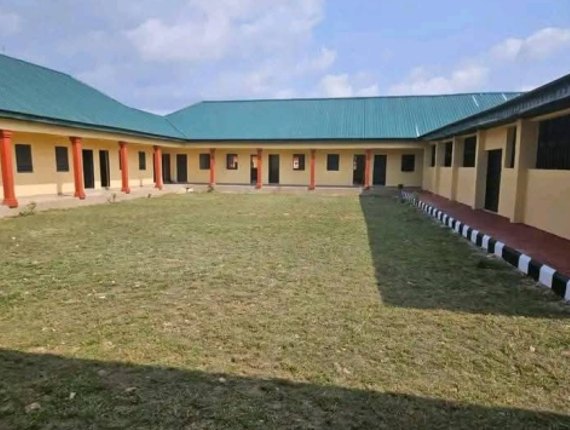 Grass courtyard enclosed by the school classroom blocks