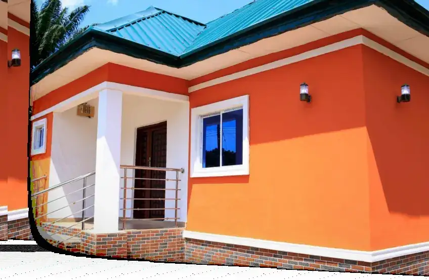 Orange bungalow with a teal roof.