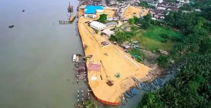 Aerial view of a cleared and sand-filled shoreline at Oron.