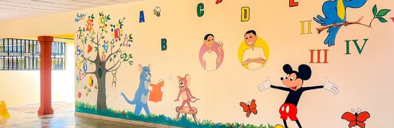 Painted wall mural in a classroom at the Uko Oyukim model school