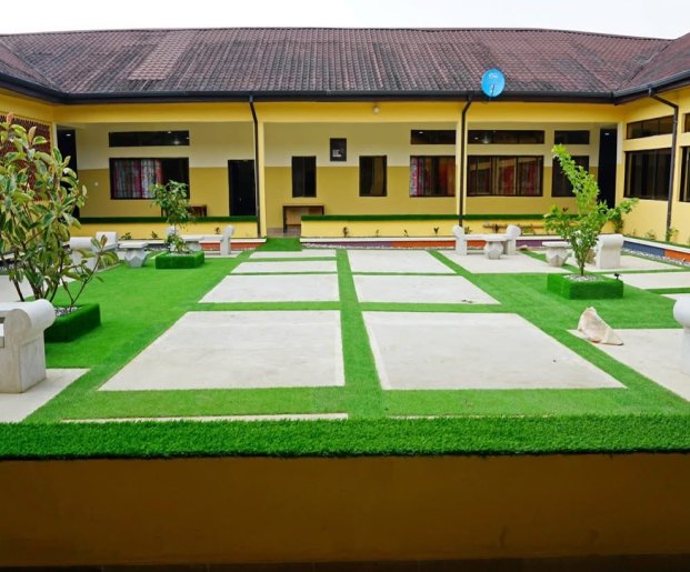 Hospital courtyard with paved walkways between two wings