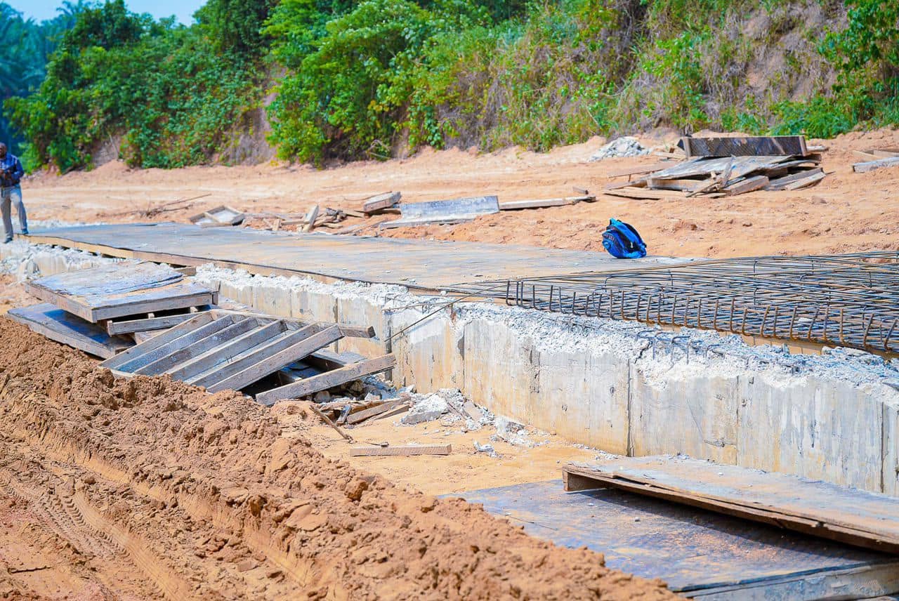Concrete drainage channel under construction in the reclaimed gully