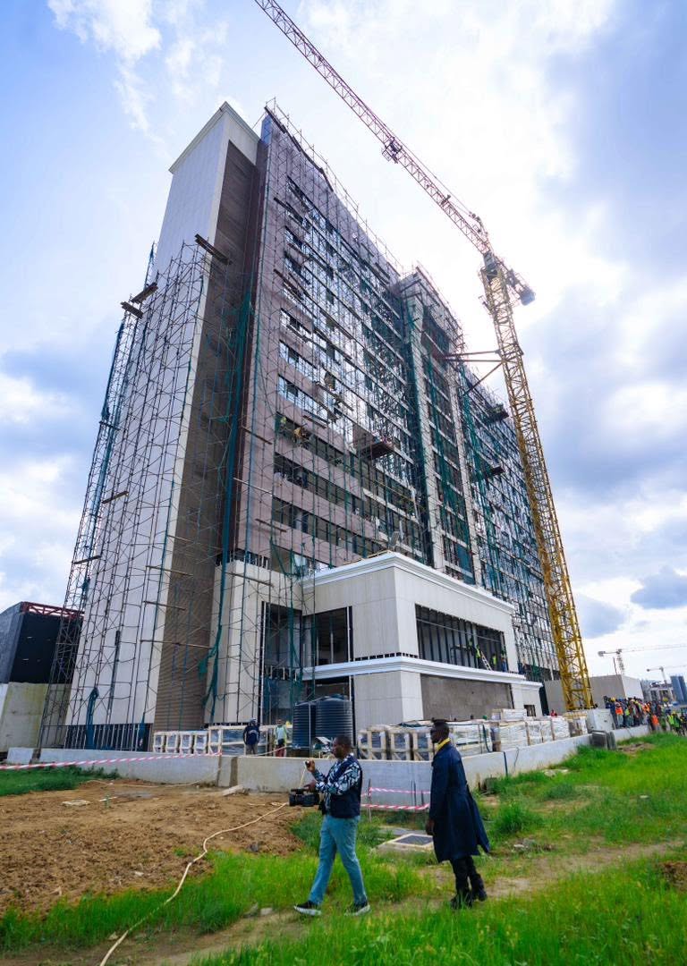 The high-rise hotel building nearing completion with cladding going up