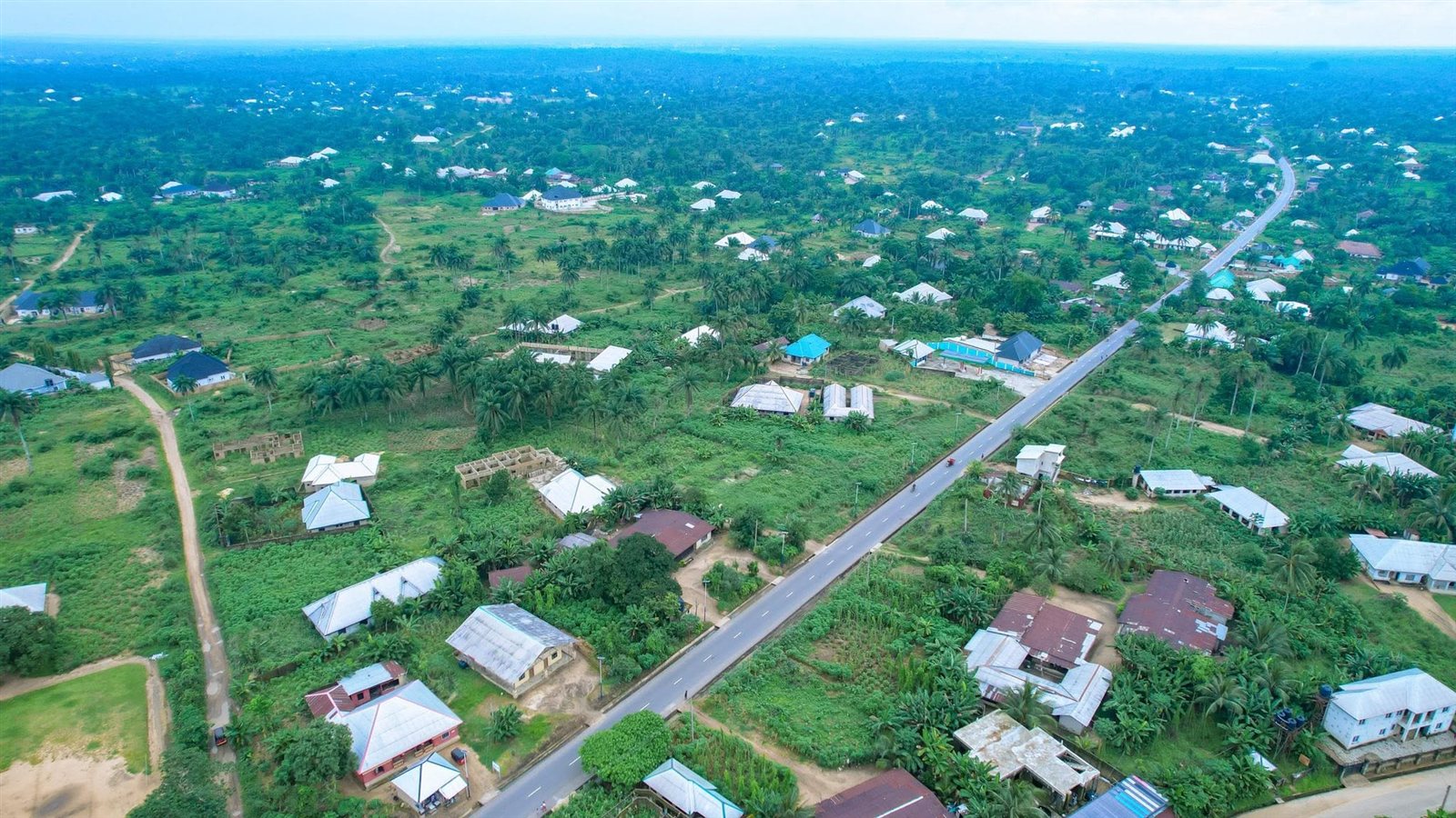 Aerial view of the road running through farmland and villages