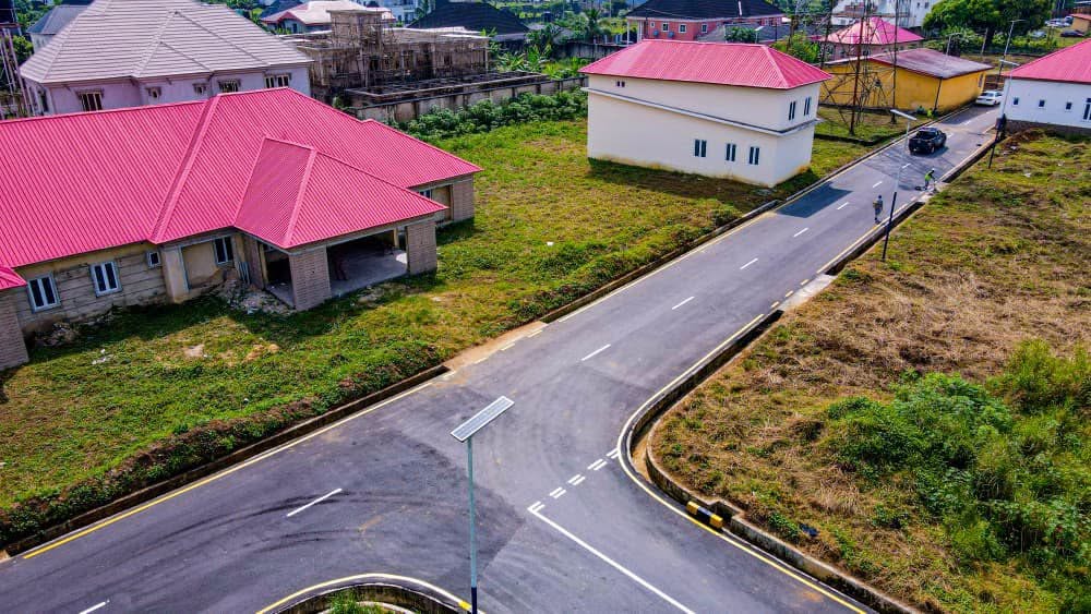 Aerial view of the roads with kerbs and solar streetlights near staff buildings