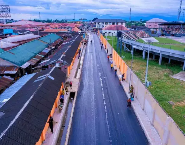 Road with market buildings alongside, Uyo
