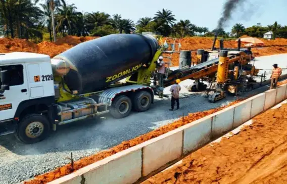 Concrete and paving works on a road with drainage channel