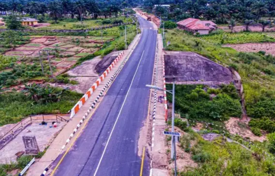 Aerial view of a road with drainage channel and bridge approach