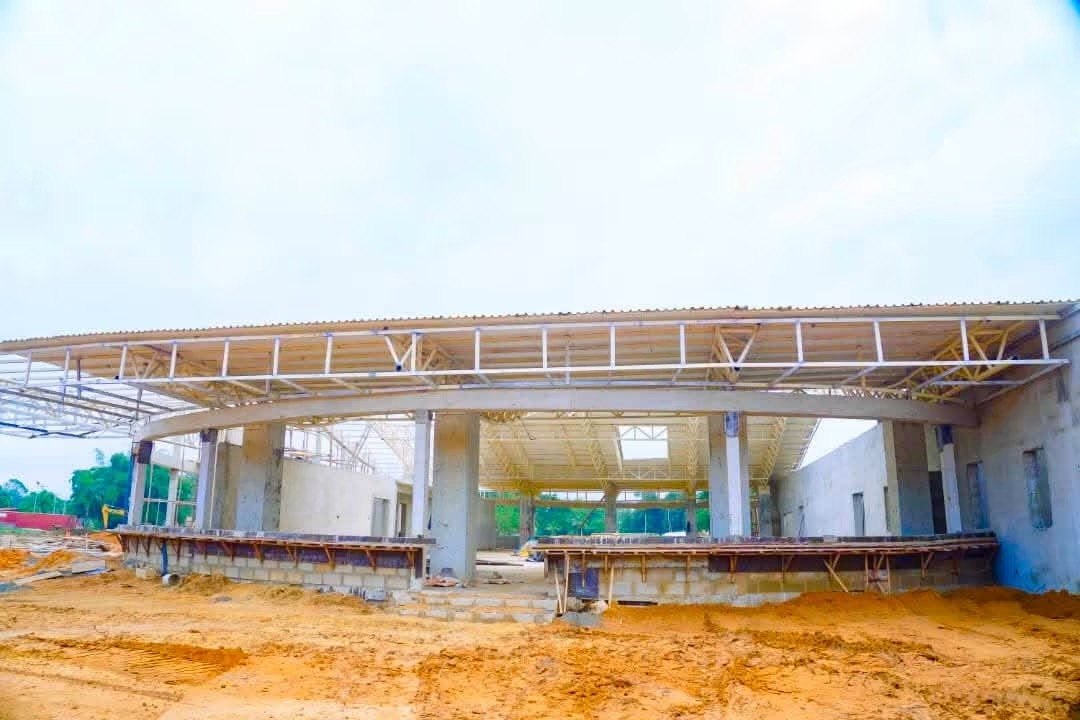 Inside the main building, with the curved roof beam in place